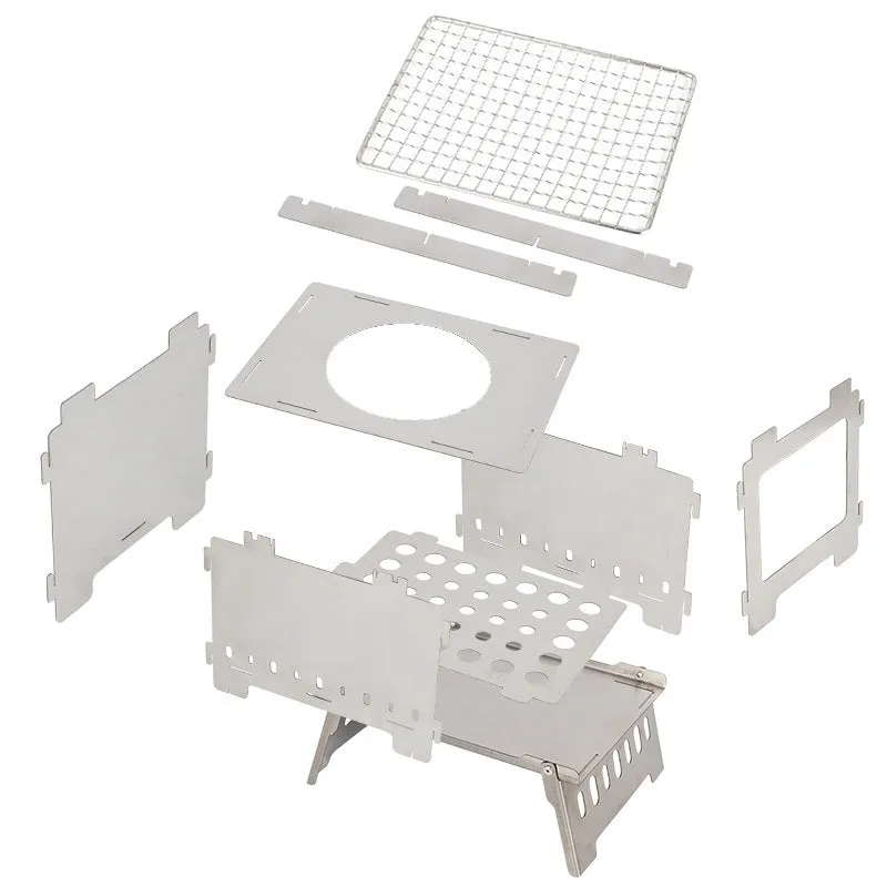 Silver outdoor folding card stove with grill mesh and storage bag on table