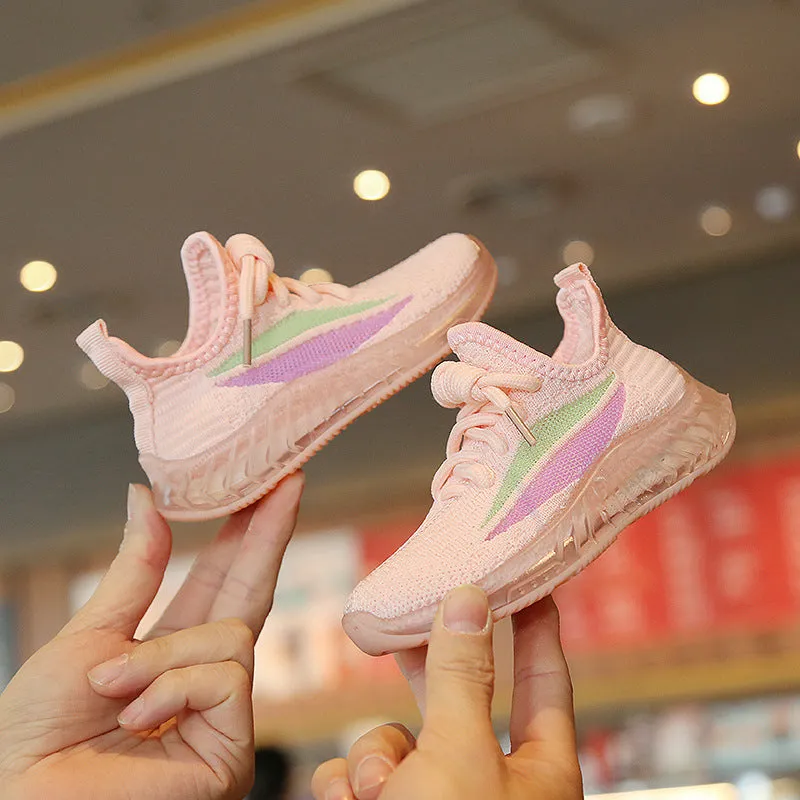 Children's white woven mesh sports shoes with rubber sole, side view on light background