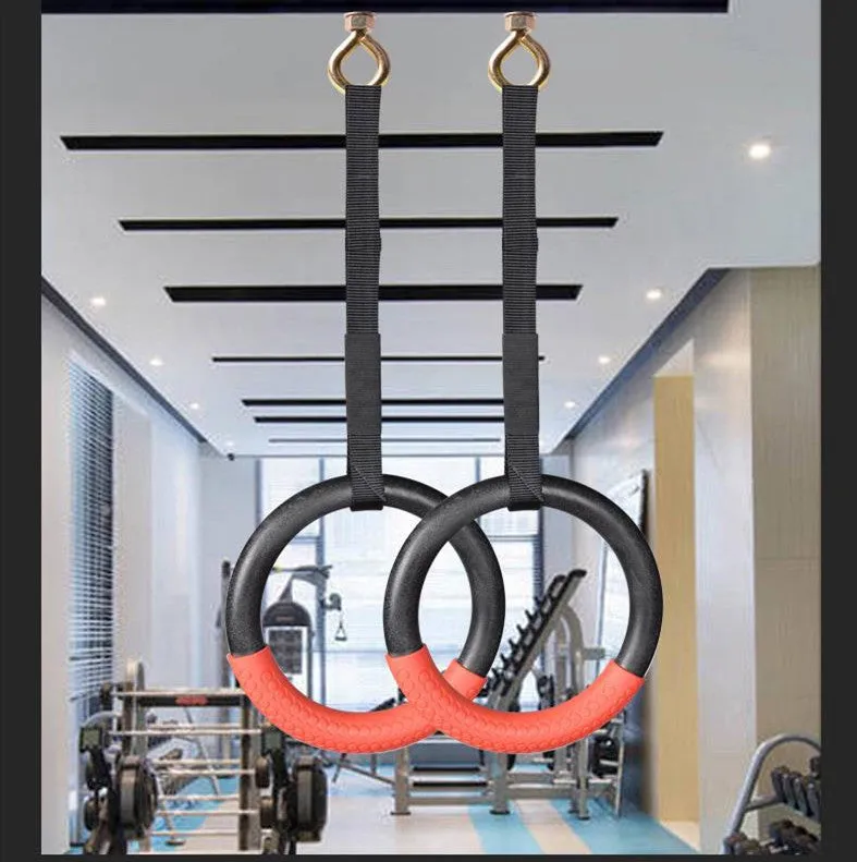 Red gymnastic rings with birch sling and rubber ring on a horizontal bar, outer diameter 24cm, 250kg load capacity