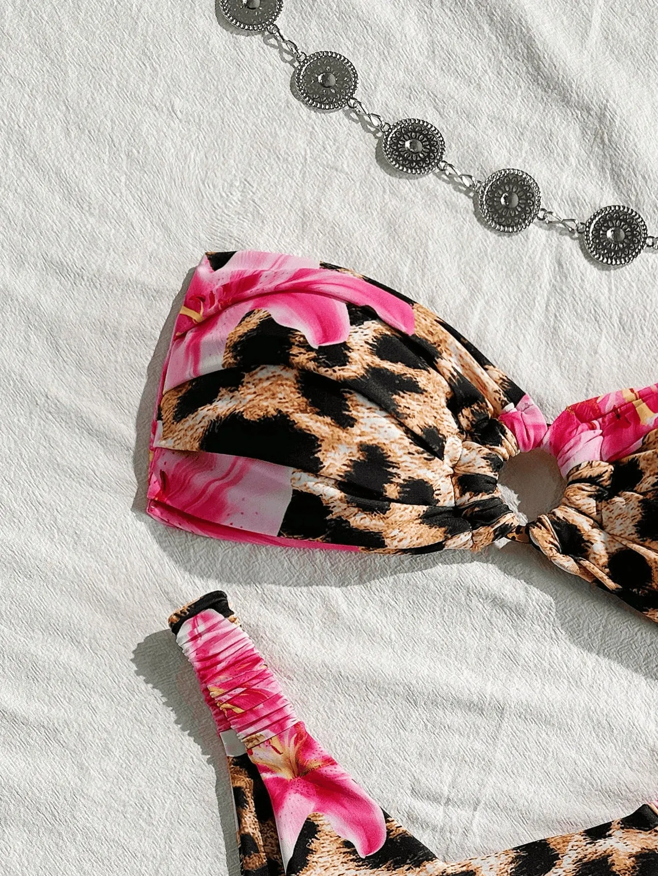 Pink leopard print women's tube top split bikini swimsuit on white background