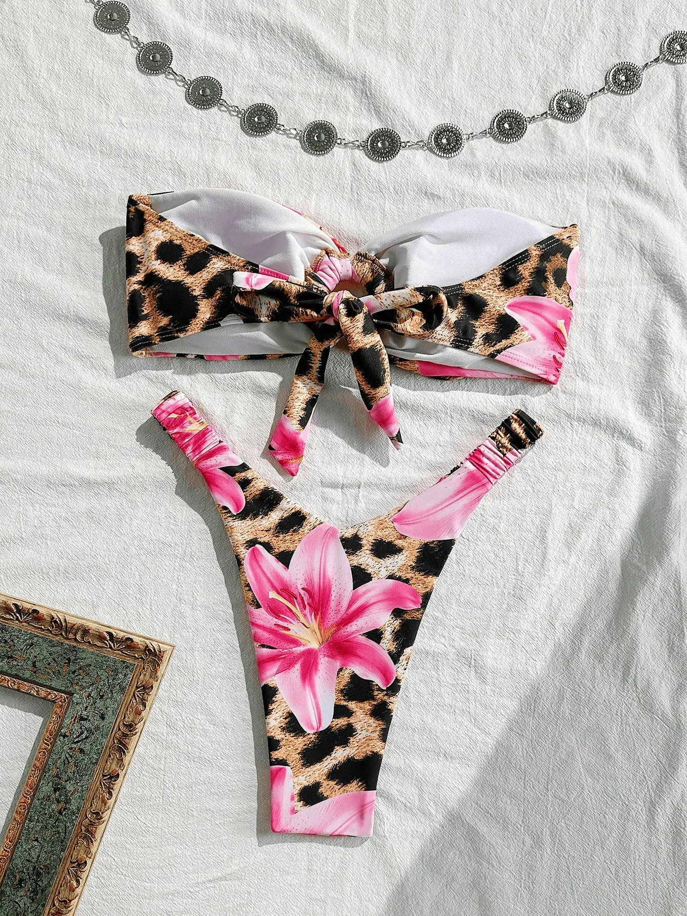 Pink leopard print women's tube top split bikini swimsuit on white background