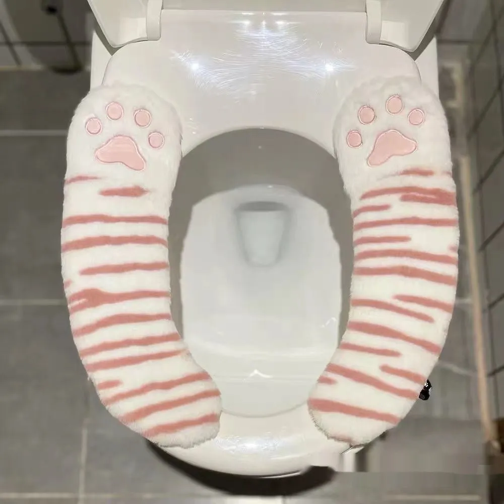 Plush toilet seat cushion with adhesive Velcro fastener in black and white stripes for bathroom use