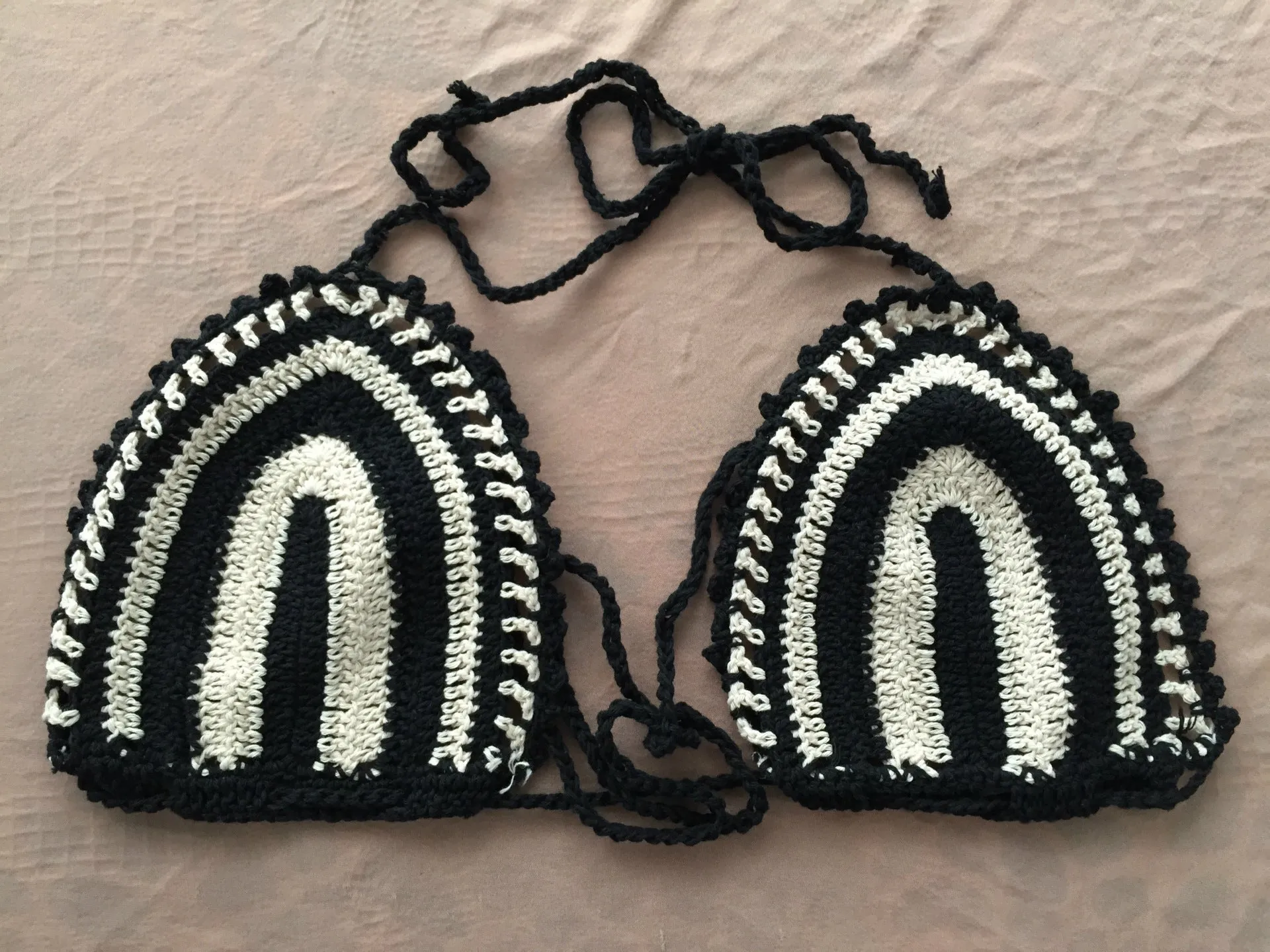 Hand crochet bikini set with cotton wrap top and woven texture on a woman by the beach