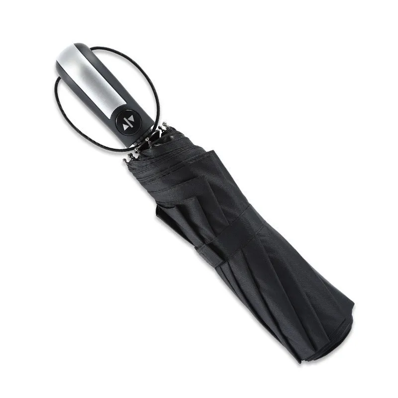 Large black automatic triple-fold umbrella with palace style canopy and rubber handle.