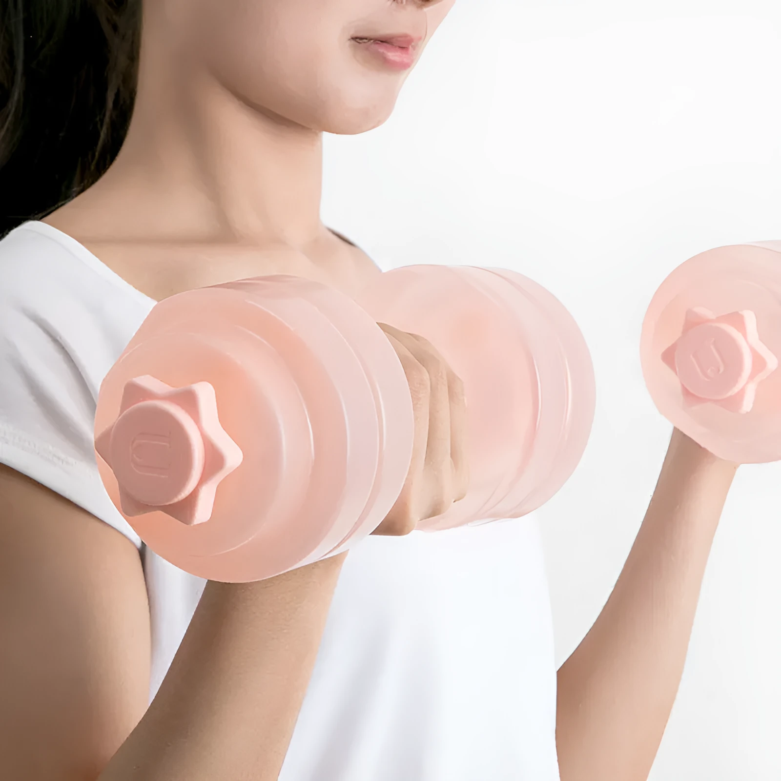 Mini portable plastic water dumbbell in transparent pink with water fill, PE construction, 262x97x94cm size for home strength training.