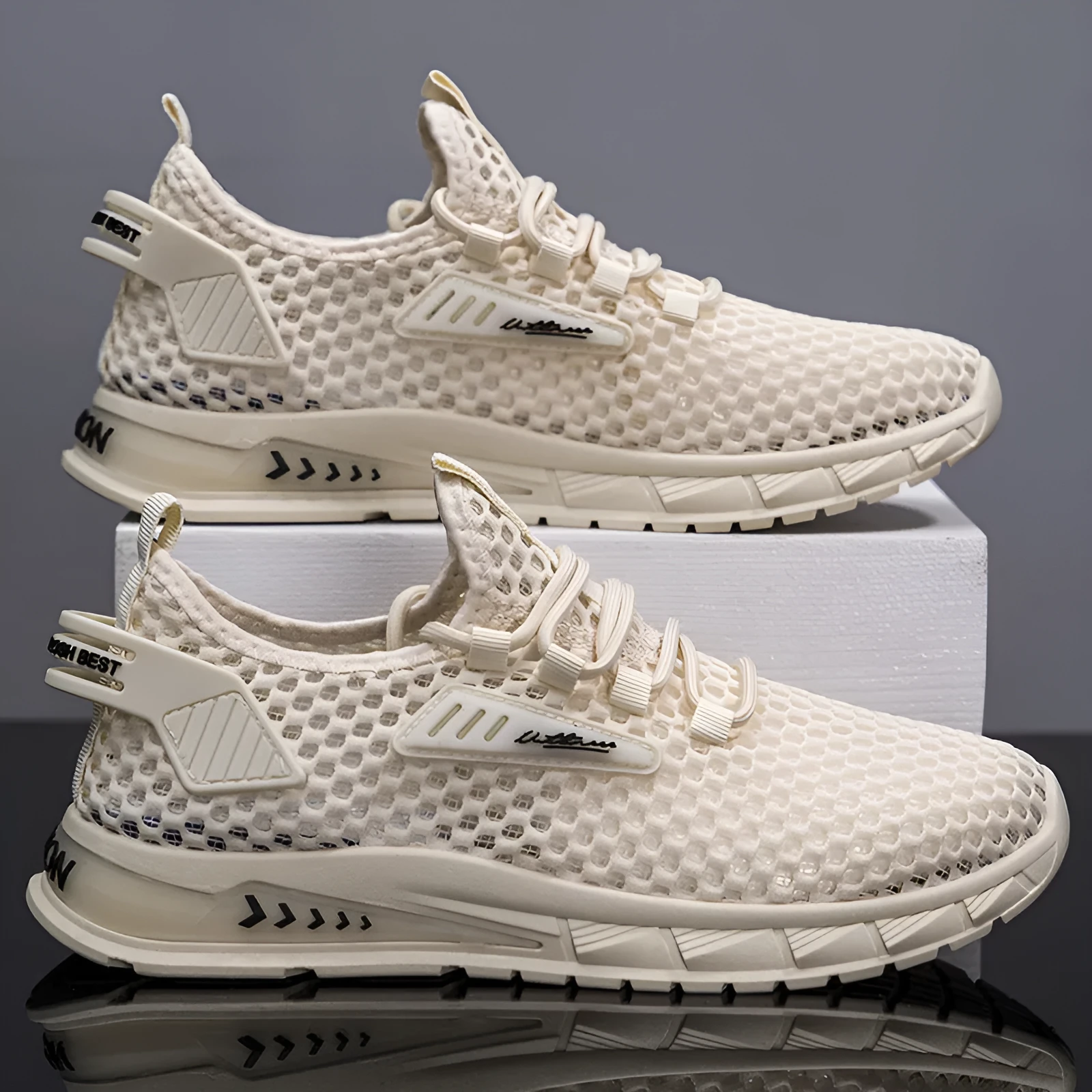 Men's beige casual sneaker with mesh lining, synthetic leather upper, and flat EVA sole on a plain background.