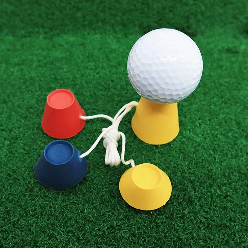 Set of four rubber golf tee ball holders in blue, yellow, and red with four feet each, 2cm height