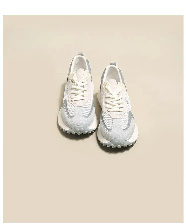 Women's grey and pink retro sneaker with low top design and round toe