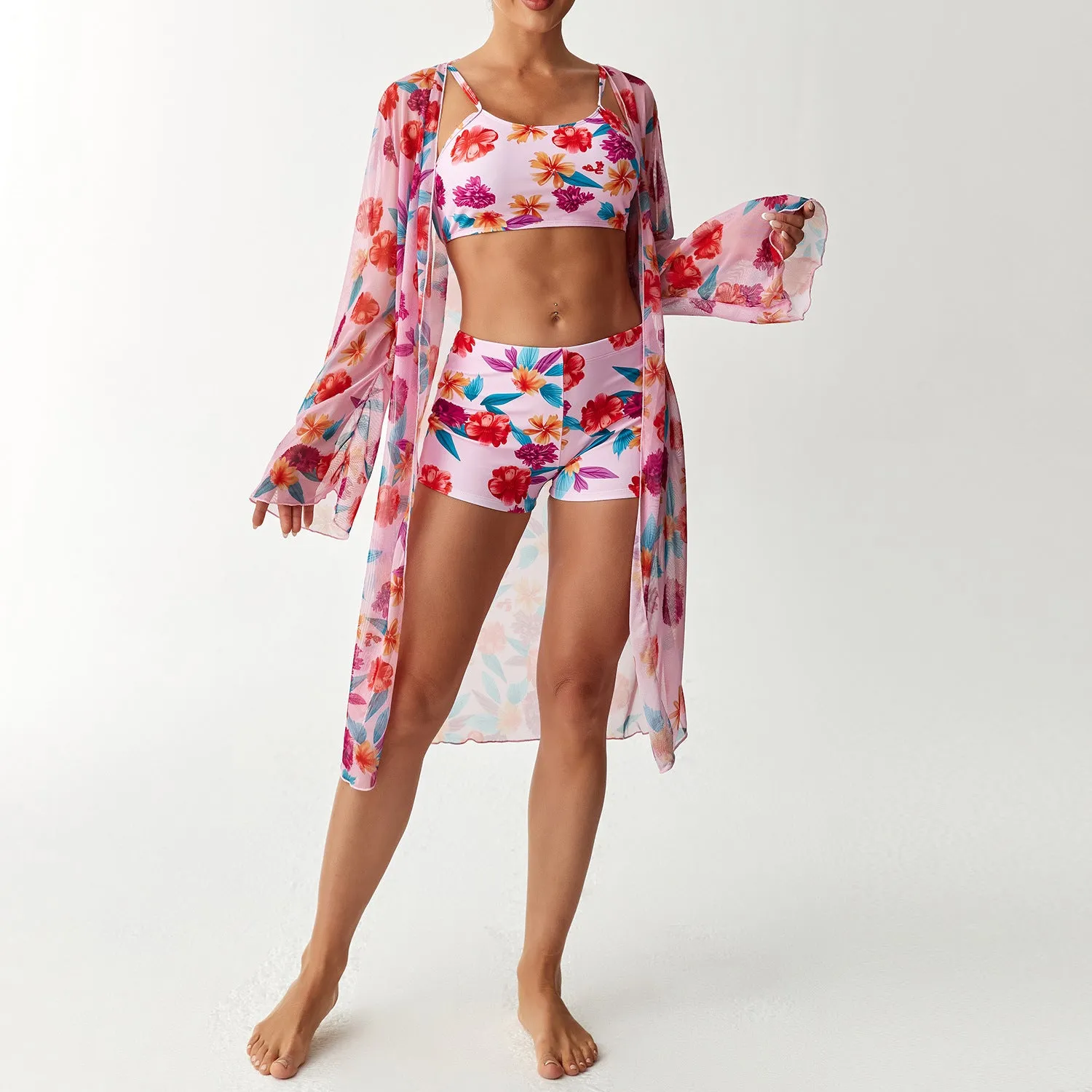 Women's three-piece swimsuit set with long sleeve blouse in pink, black, white, and sapphire blue