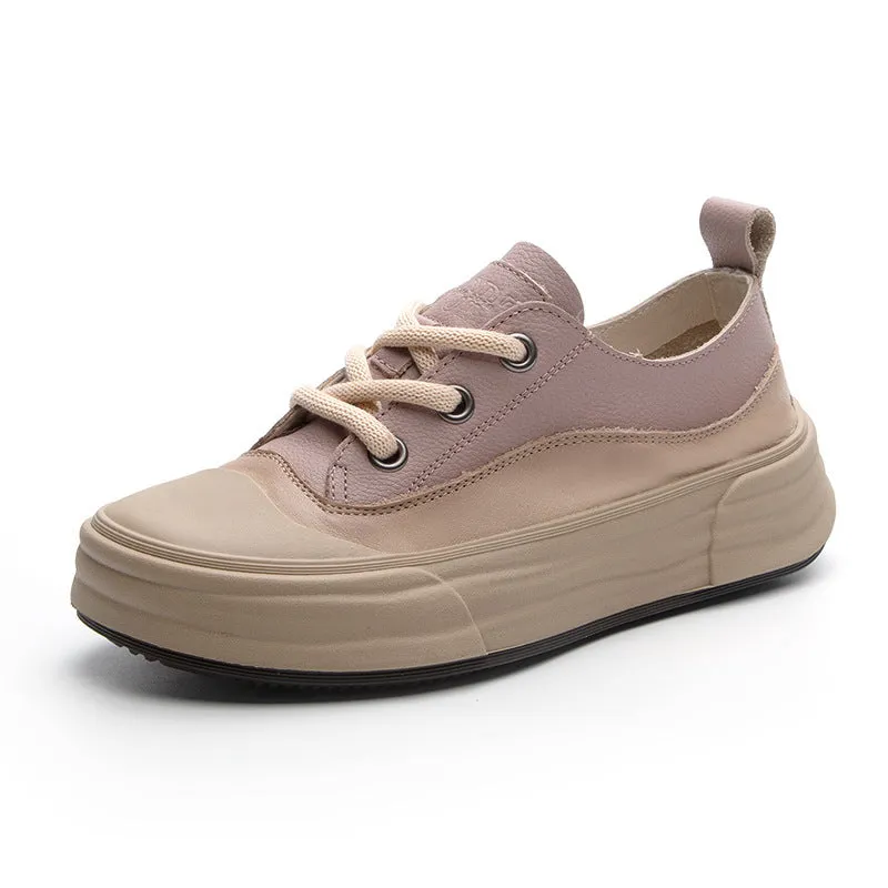 Women's matcha green leather platform sneakers with round toe and white laces on a flat sole.