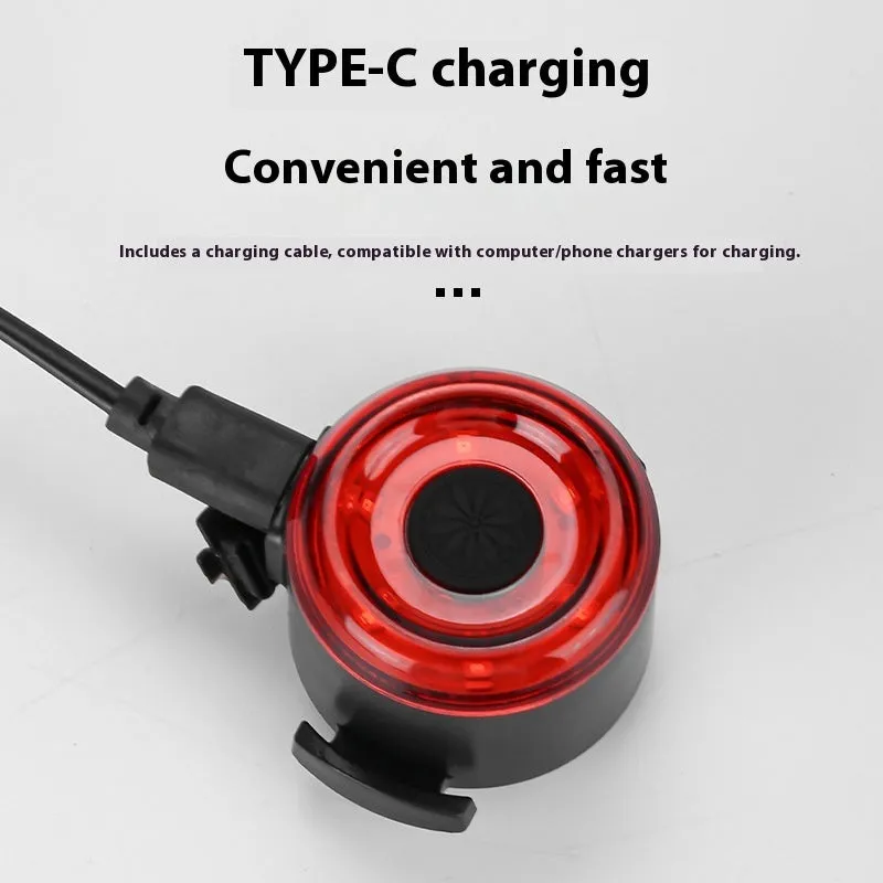 Round red bike warning light with silicone straps and USB cable for night riding