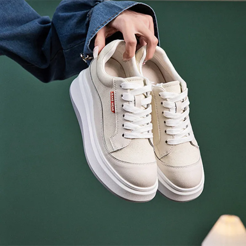 Women's beige and pink leather board shoes with thick soles showing cowhide uppers