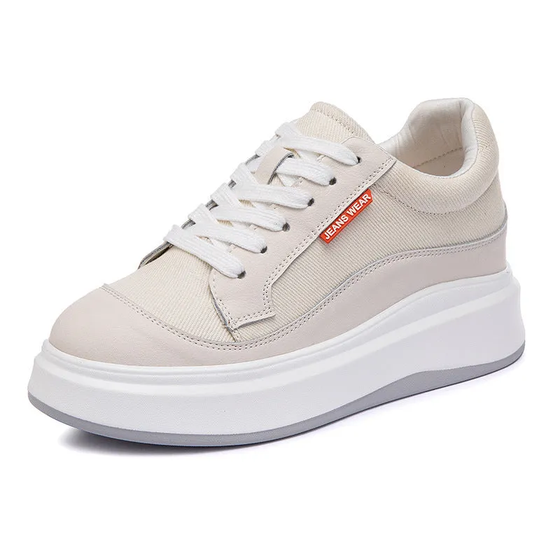 Women's beige and pink leather board shoes with thick soles showing cowhide uppers