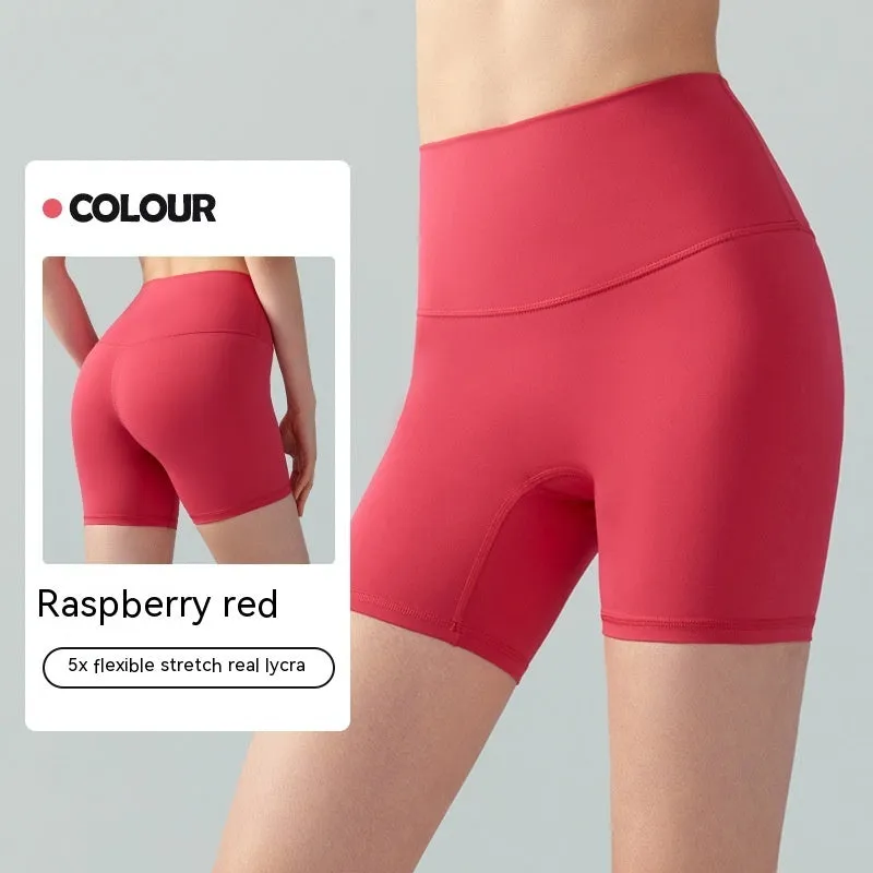 Woman wearing leaf green high waist Lycra yoga shorts for fitness exercise.