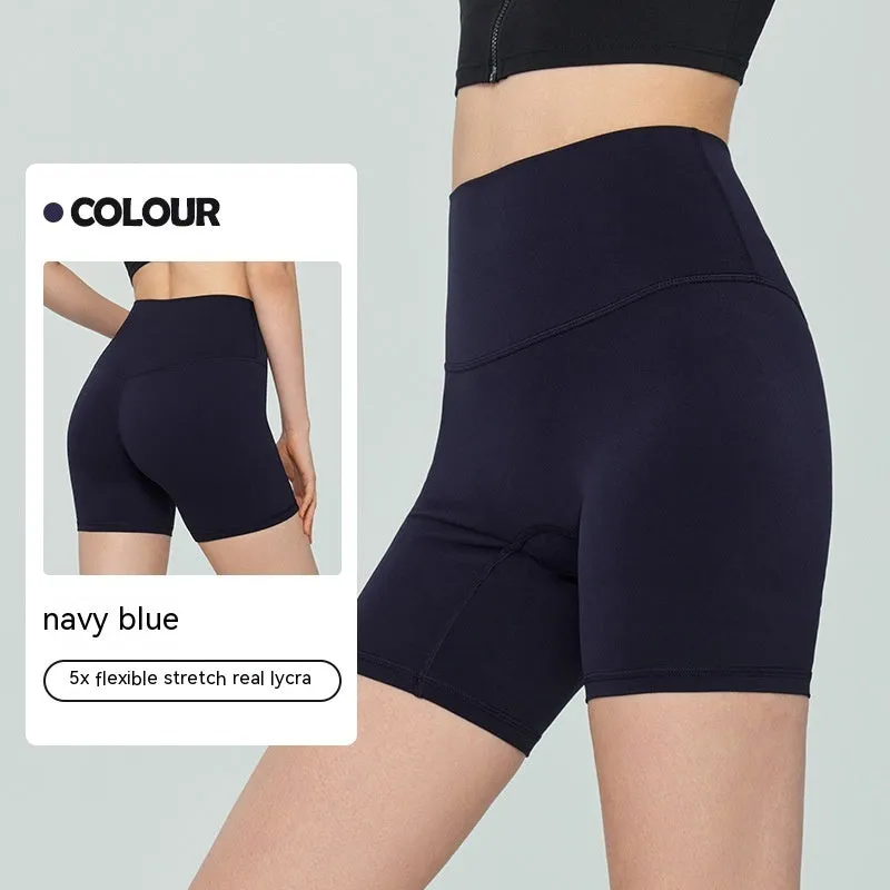 Woman wearing leaf green high waist Lycra yoga shorts for fitness exercise.
