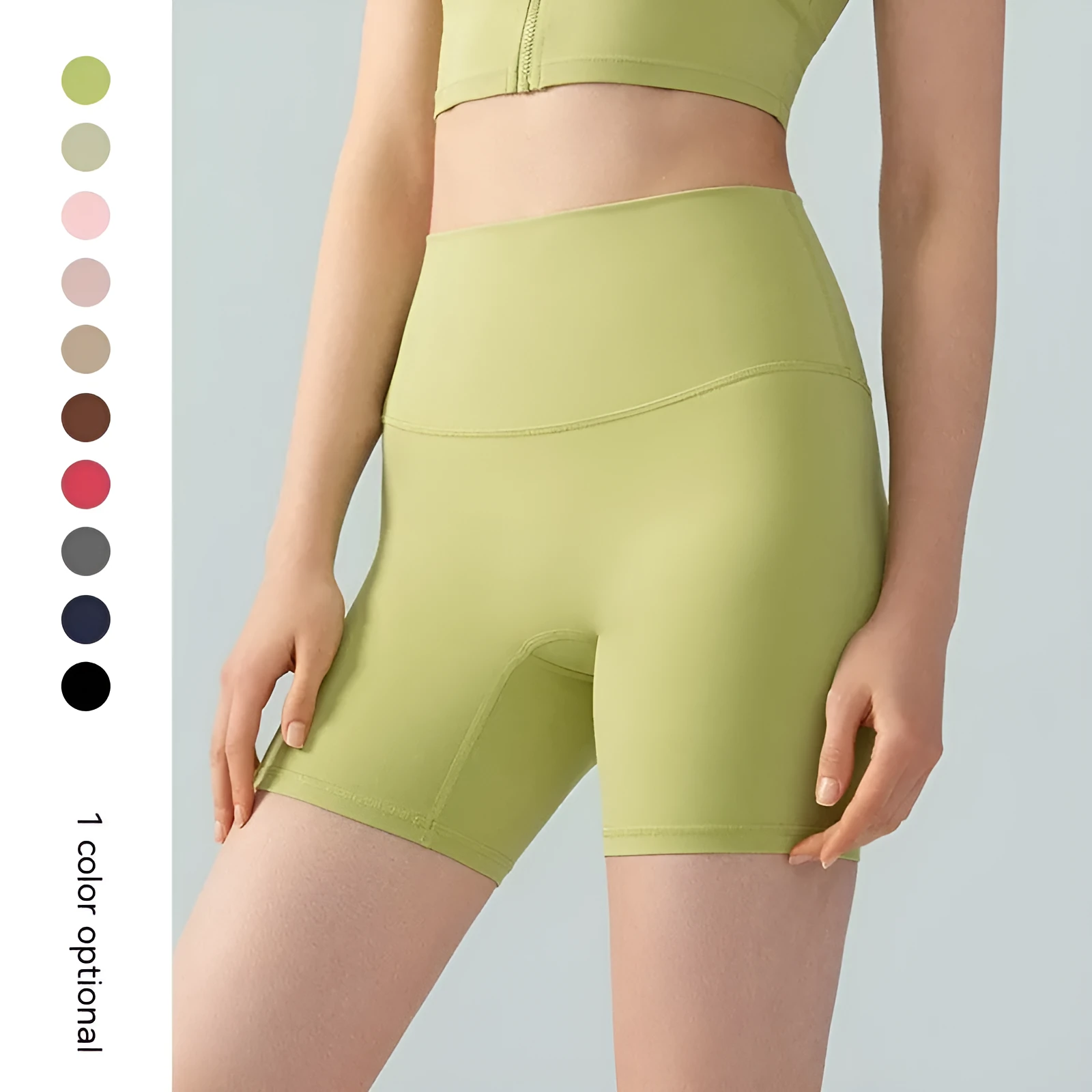 Woman wearing leaf green high waist Lycra yoga shorts for fitness exercise.