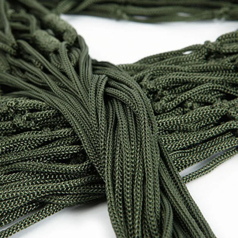 Nylon rope mesh hammock in bold blue on a green background with tie rope and cloth bag