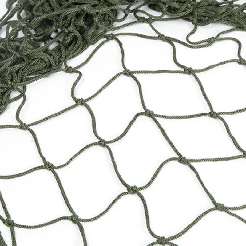 Nylon rope mesh hammock in bold blue on a green background with tie rope and cloth bag