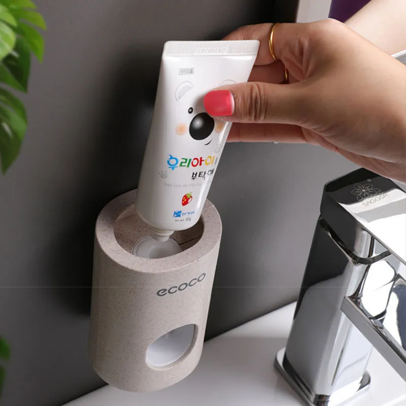 Two Ecoco single toothpaste dispensers in simple modern style, 15-18cm, on a bathroom countertop