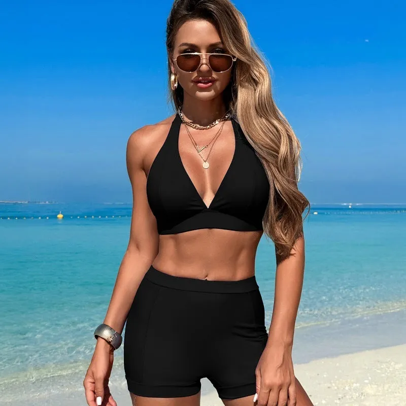 Women's black nylon bikini swimsuit on a hanger with other colour options shown.