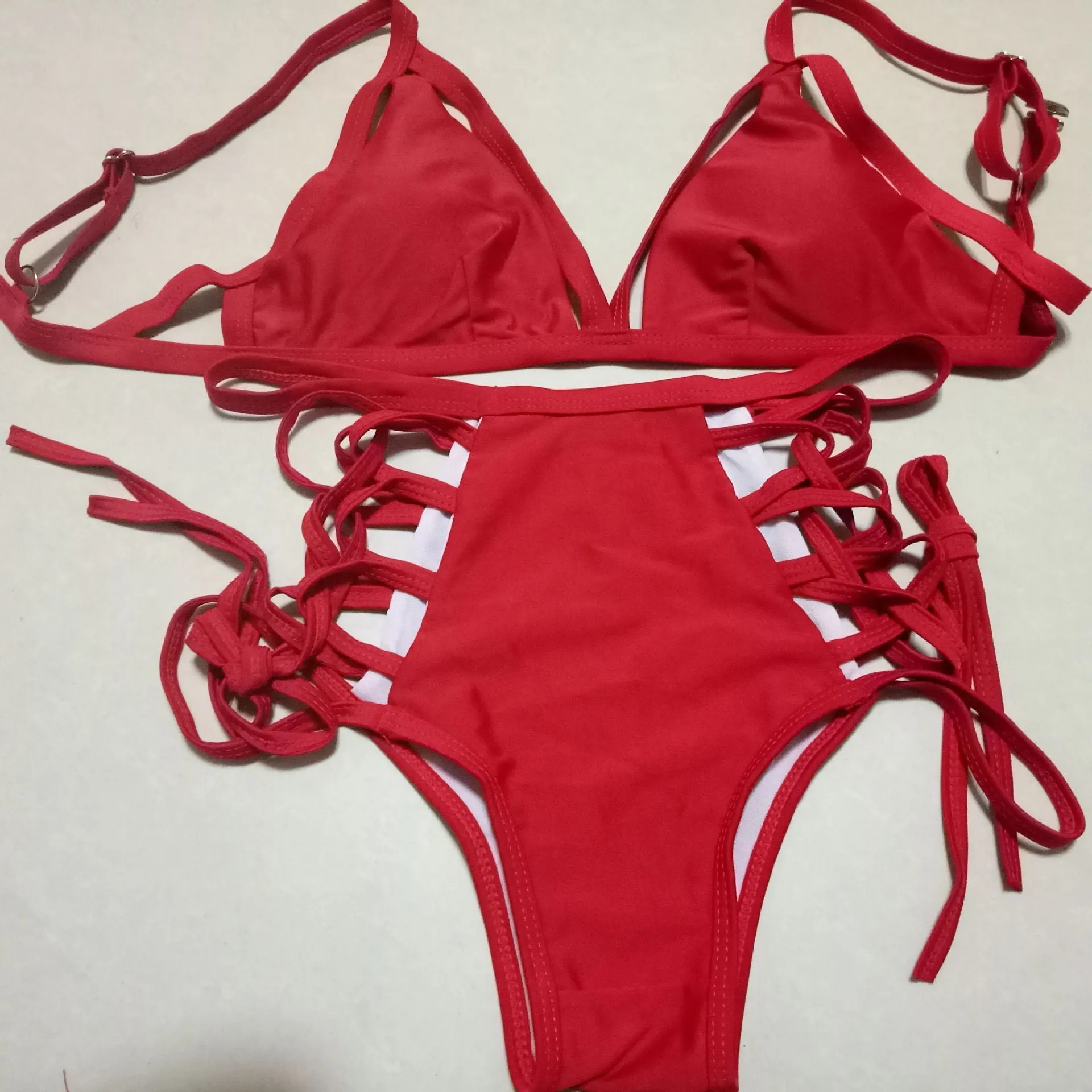 Sexy strap bikini split swimsuit in polyester fibre, available in multiple colours and Asian sizes