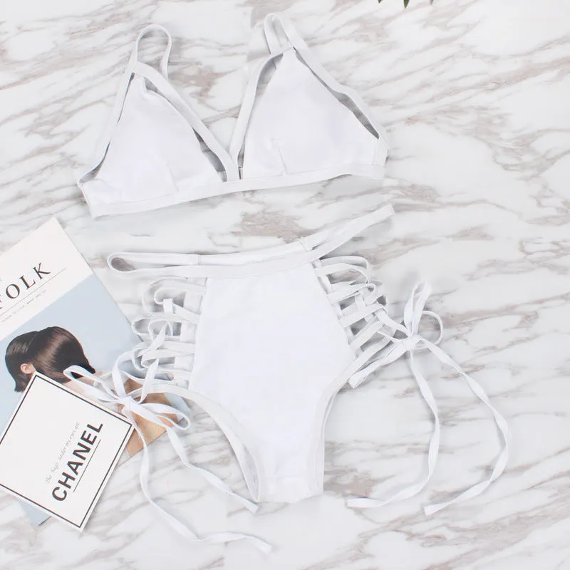 Sexy strap bikini split swimsuit in polyester fibre, available in multiple colours and Asian sizes