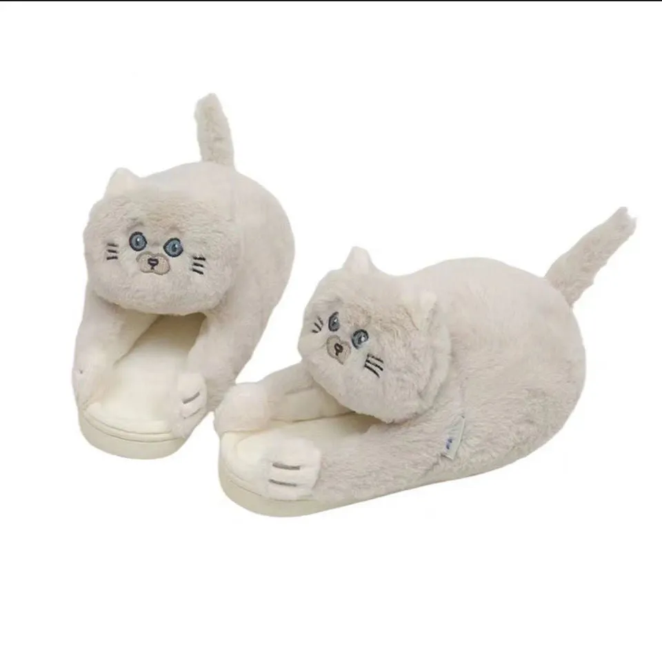 Pair of beige cat hug plush cotton slippers with non-slip sole on a soft floor