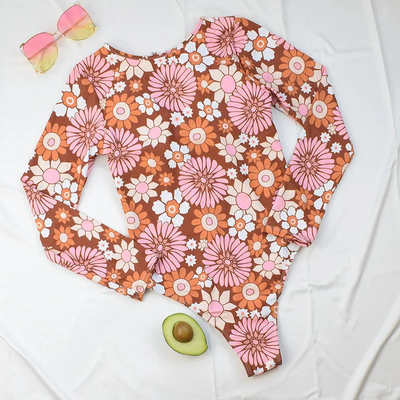 Long sleeve floral polyester swimsuit with chest pad for women, available in S M L XL