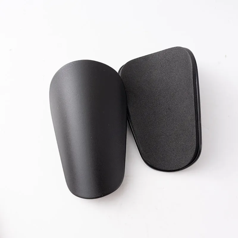 PU mini shin guards for football and outdoor sports in black, white, red, and blue.