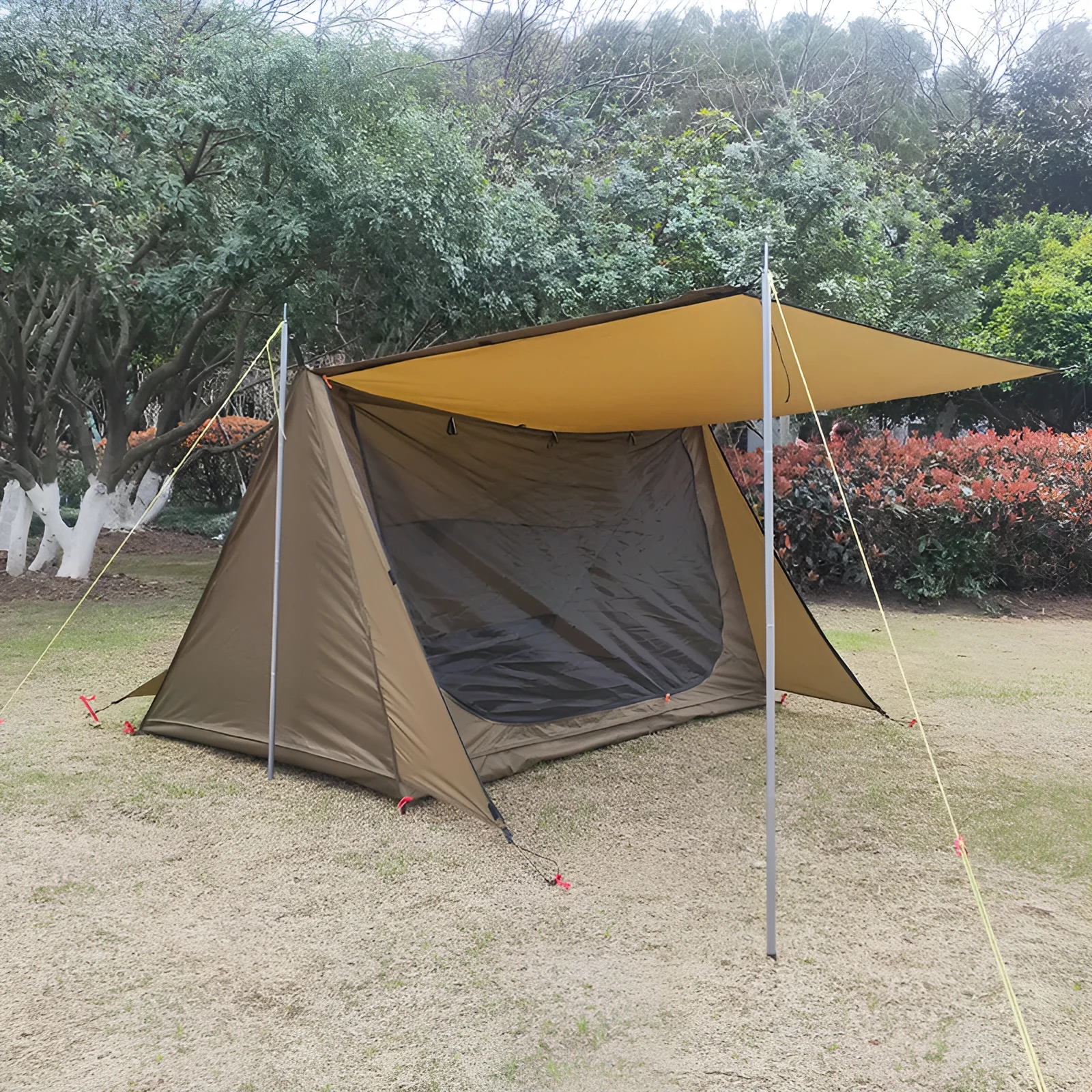 Brown two-person lightweight waterproof camping shelter tent with aluminium alloy frame set up outdoors