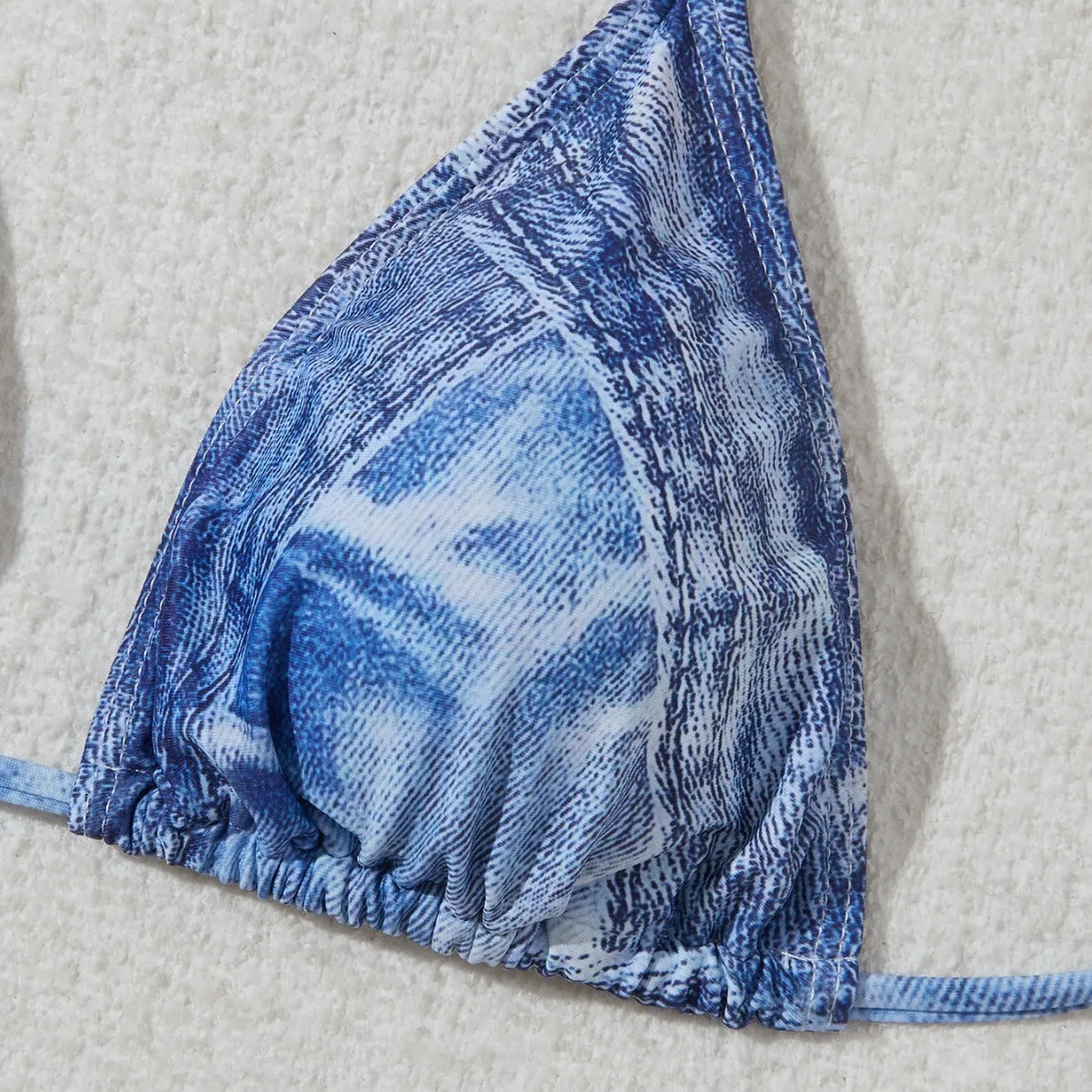 Denim blue printed women's bikini set with adjustable straps on the top.