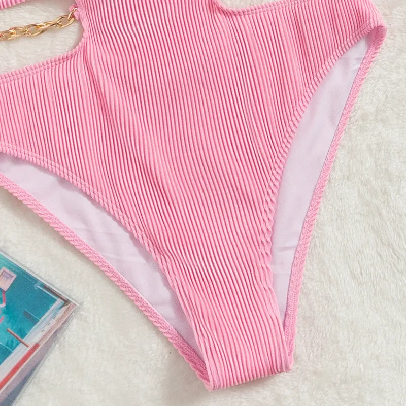 Ladies one piece solid colour swimsuit with chest pad, available in black and pink, sizes S M L