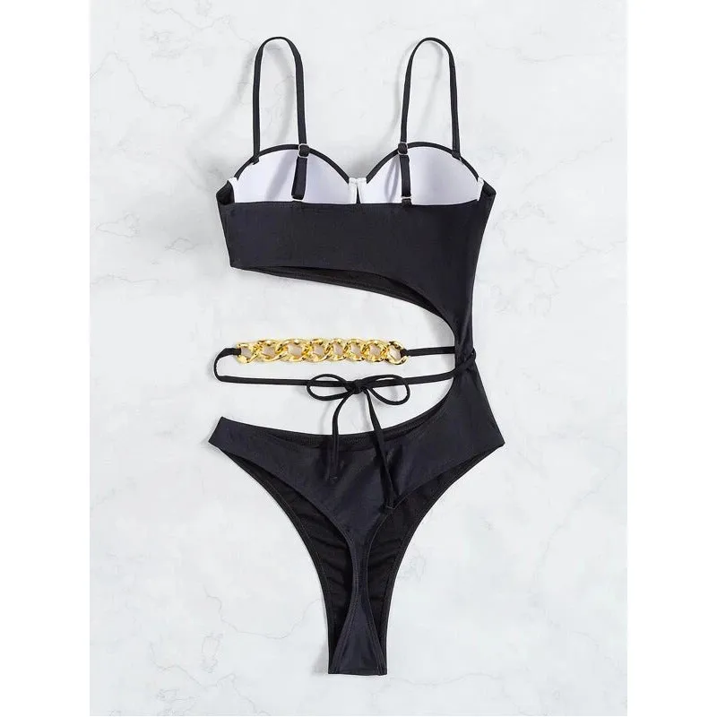 Ladies one piece solid colour swimsuit with chest pad, available in black and pink, sizes S M L