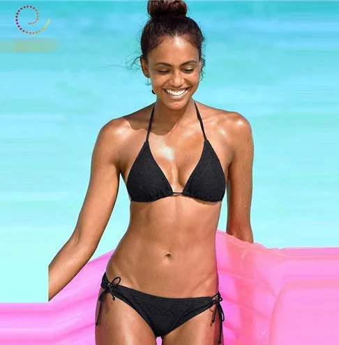Women's solid colour polyester hollow split bikini swimsuit with chest pad in [colour] for swimming wading