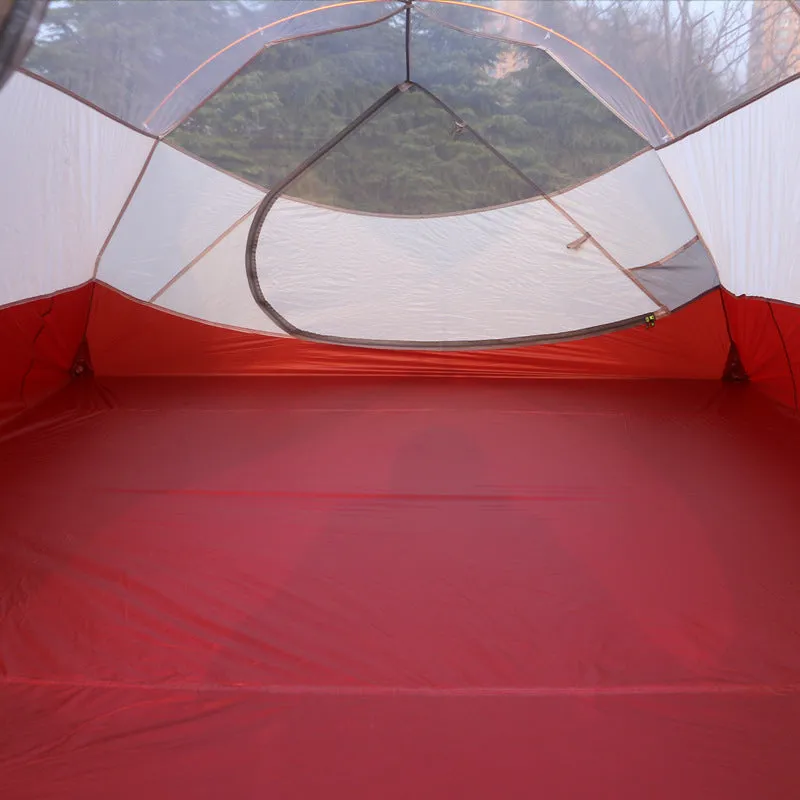 Grey outdoor multi-person tent with aluminium pole and 12 ground ropes set up on grass