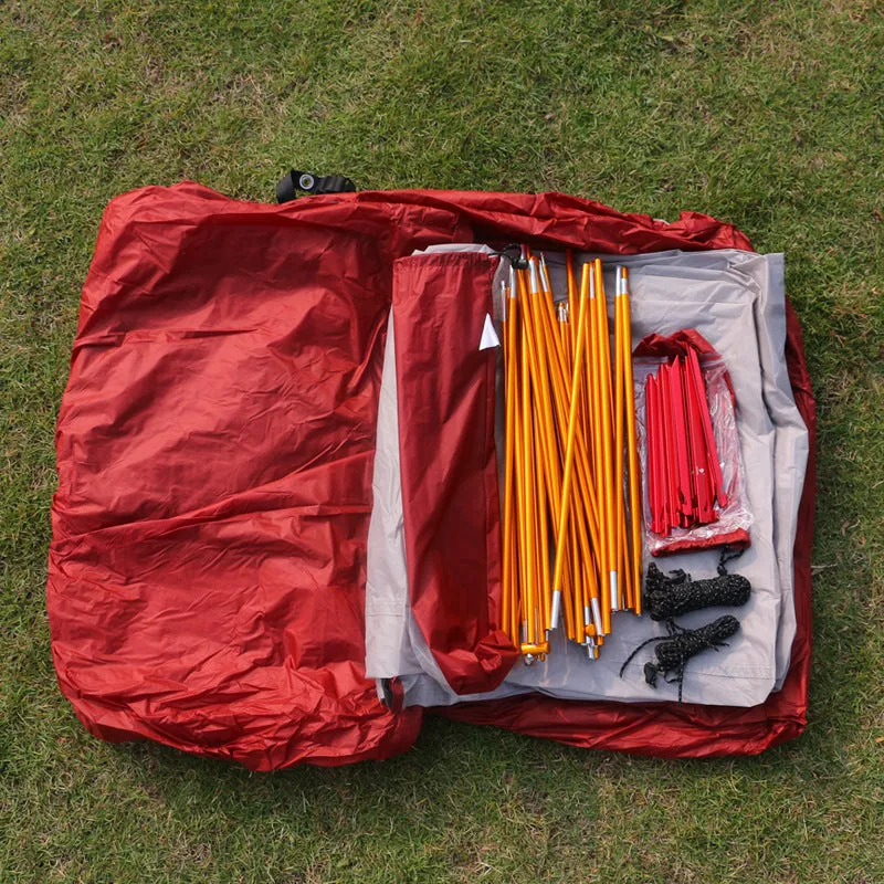 Grey outdoor multi-person tent with aluminium pole and 12 ground ropes set up on grass