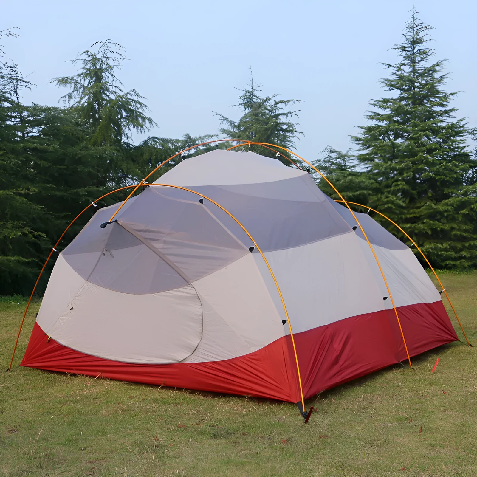 Grey outdoor multi-person tent with aluminium pole and 12 ground ropes set up on grass