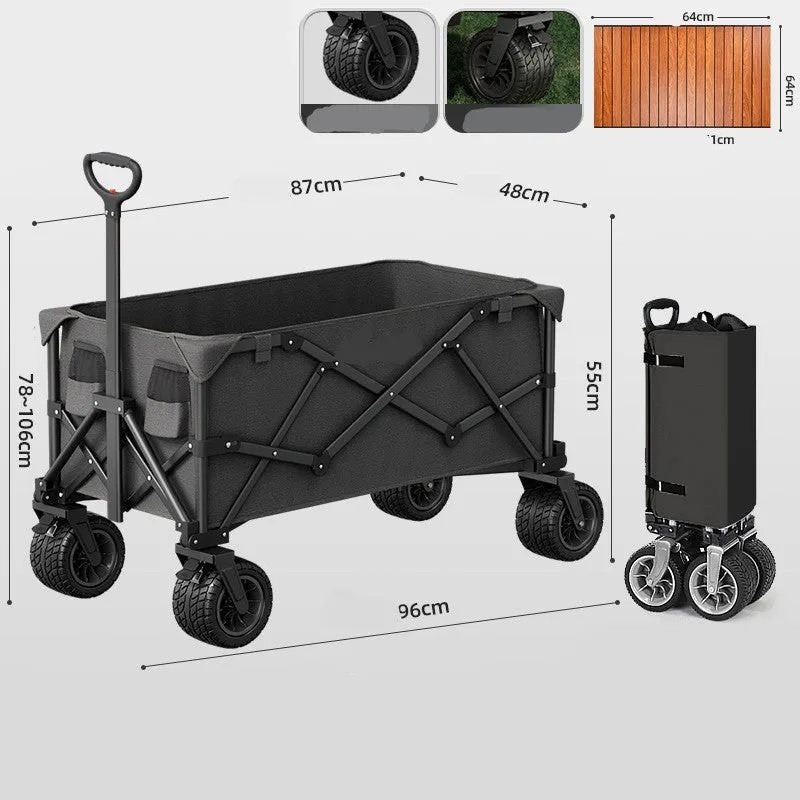 Foldable camping cart in black with 600kg capacity and push-pull handle on grass