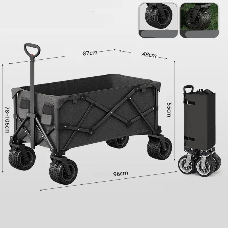 Foldable camping cart in black with 600kg capacity and push-pull handle on grass