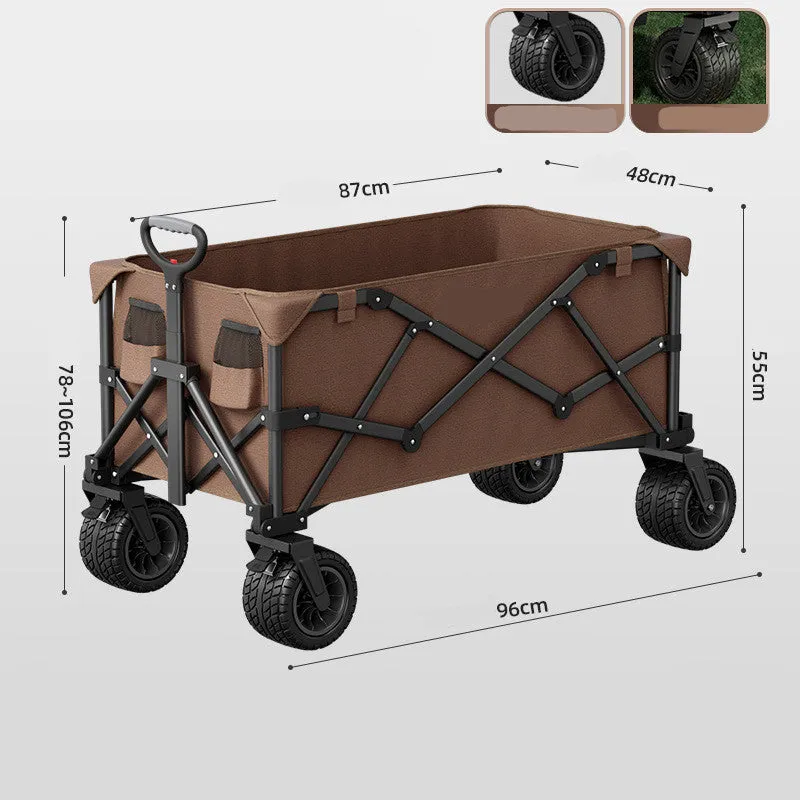 Foldable camping cart in black with 600kg capacity and push-pull handle on grass