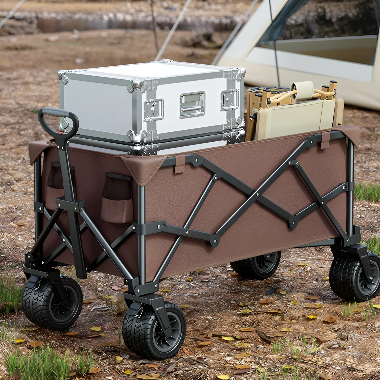 Foldable camping cart in black with 600kg capacity and push-pull handle on grass