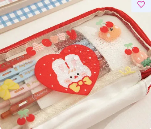 Transparent heart-shaped pen bag with rabbit pattern design in pink and red colour options
