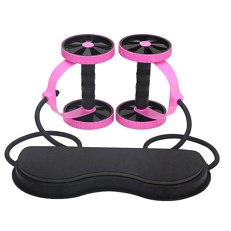 Revoflex Xtreme pink multifunctional abdominal wheel with 12cm diameter on a flat surface