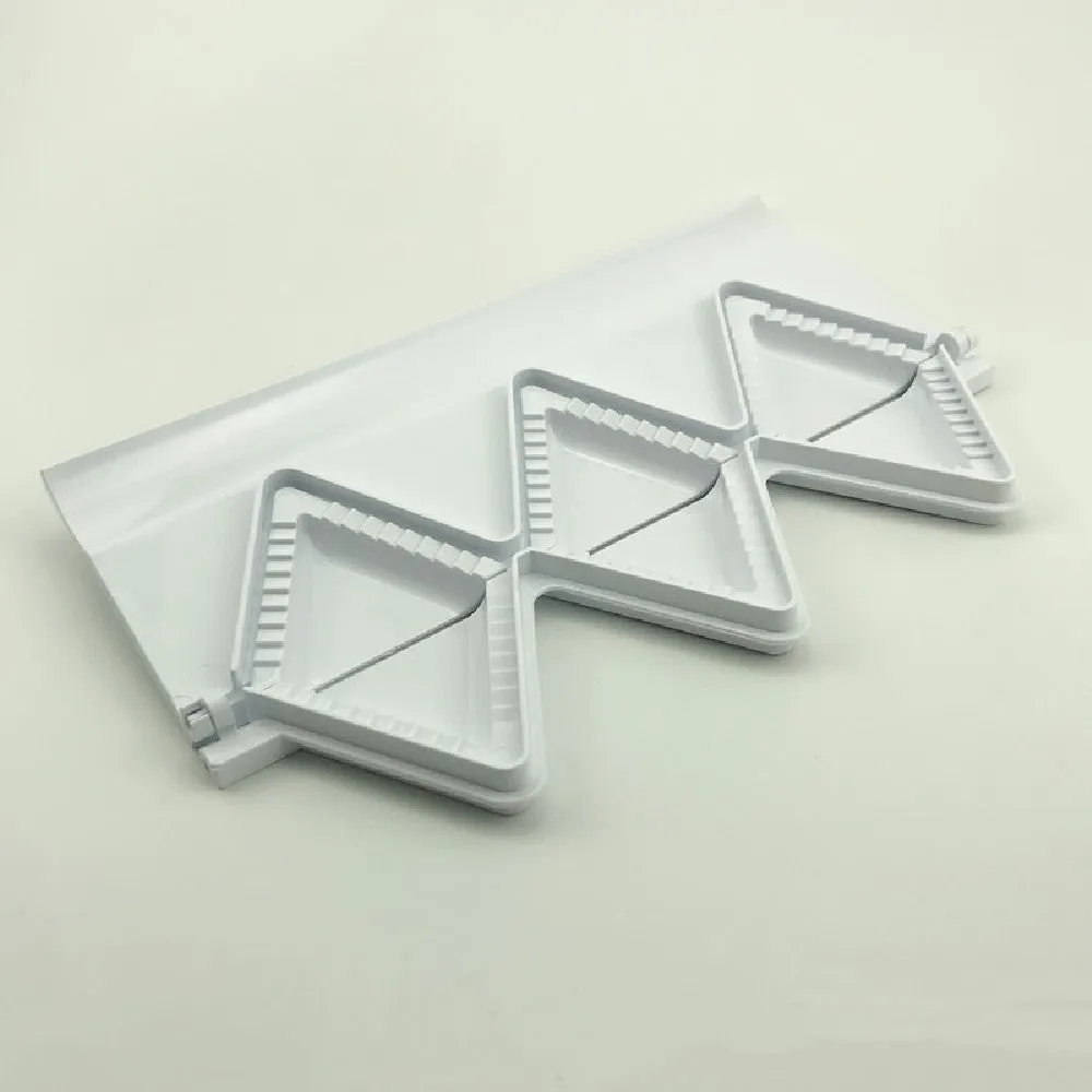 Pure white plastic dumpling maker 28.5cm length on a kitchen counter