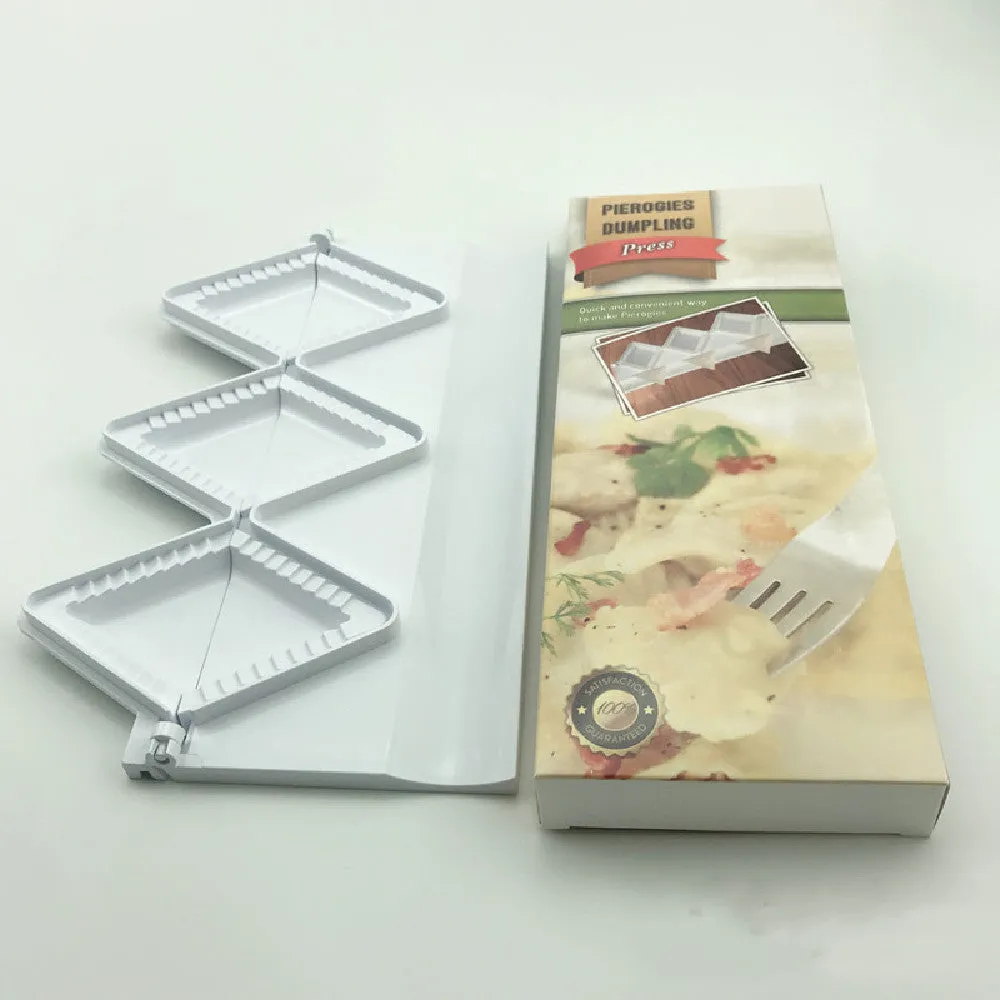 Pure white plastic dumpling maker 28.5cm length on a kitchen counter