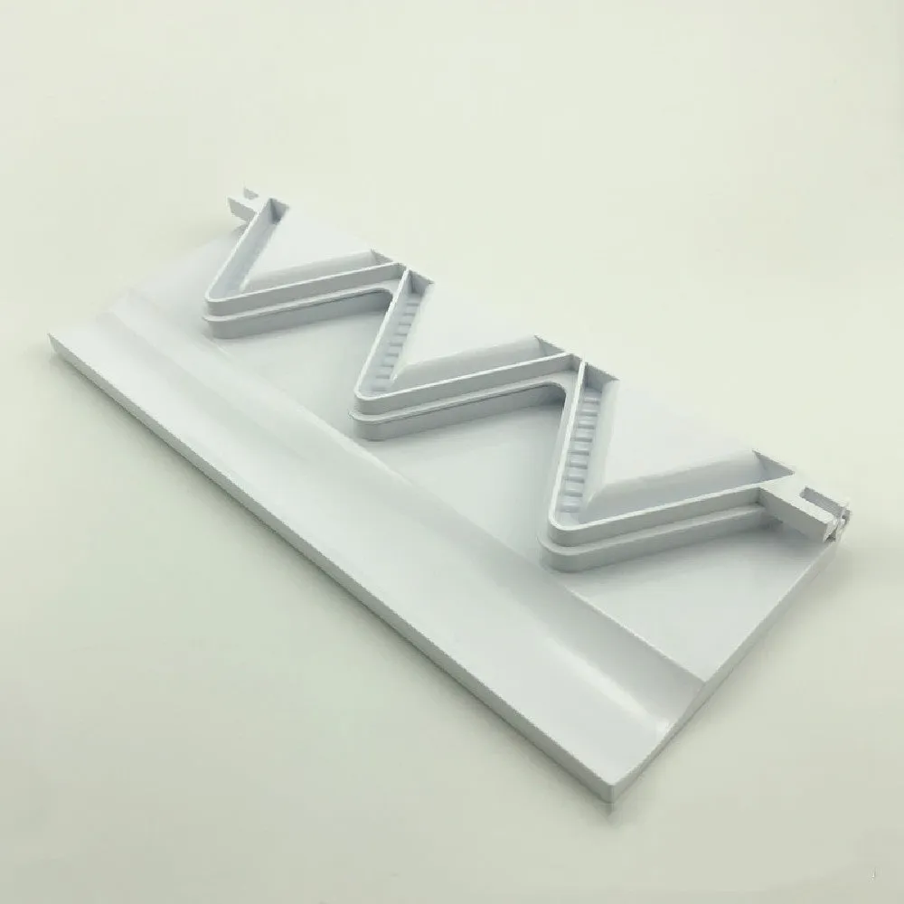 Pure white plastic dumpling maker 28.5cm length on a kitchen counter