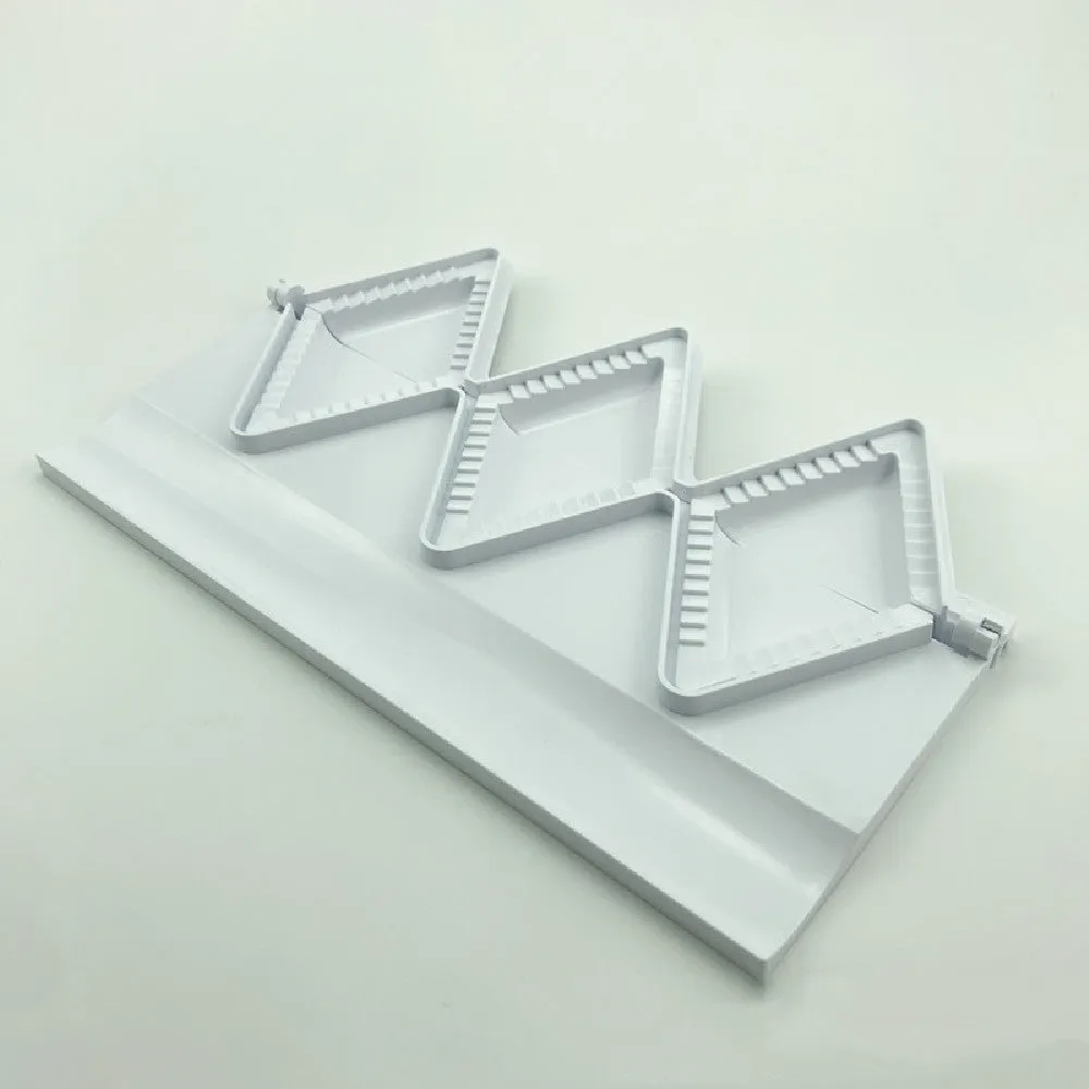 Pure white plastic dumpling maker 28.5cm length on a kitchen counter