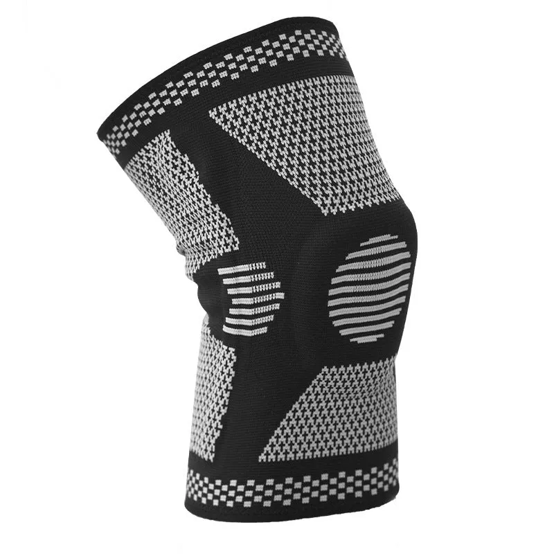 Blue sports knee pad with a visible silicone spring circle on a polyamide sleeve.