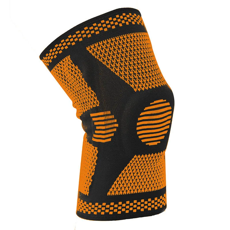 Blue sports knee pad with a visible silicone spring circle on a polyamide sleeve.