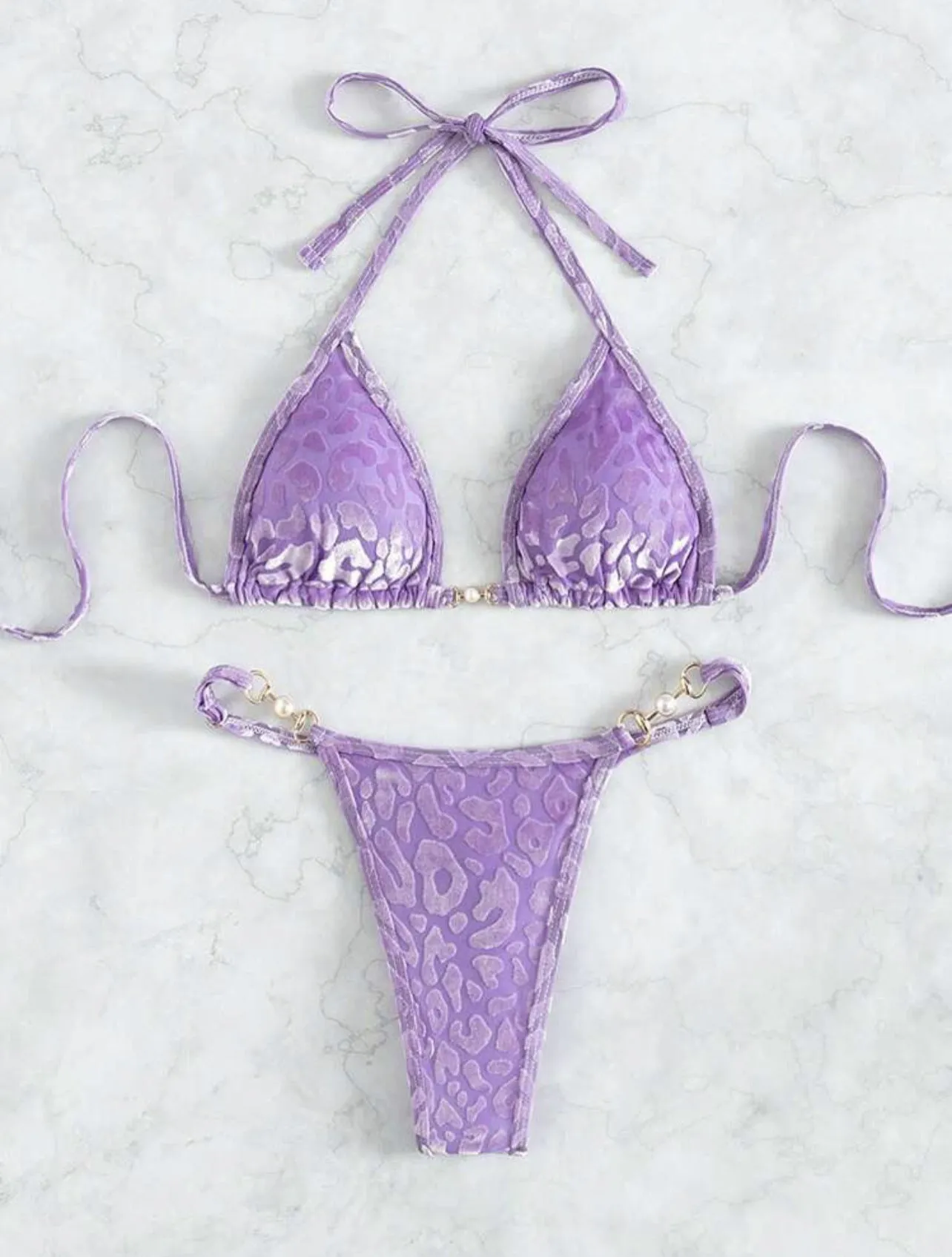 Women's blue leopard print T-shaped swimwear bikini set made from polyester and spandex fabric.